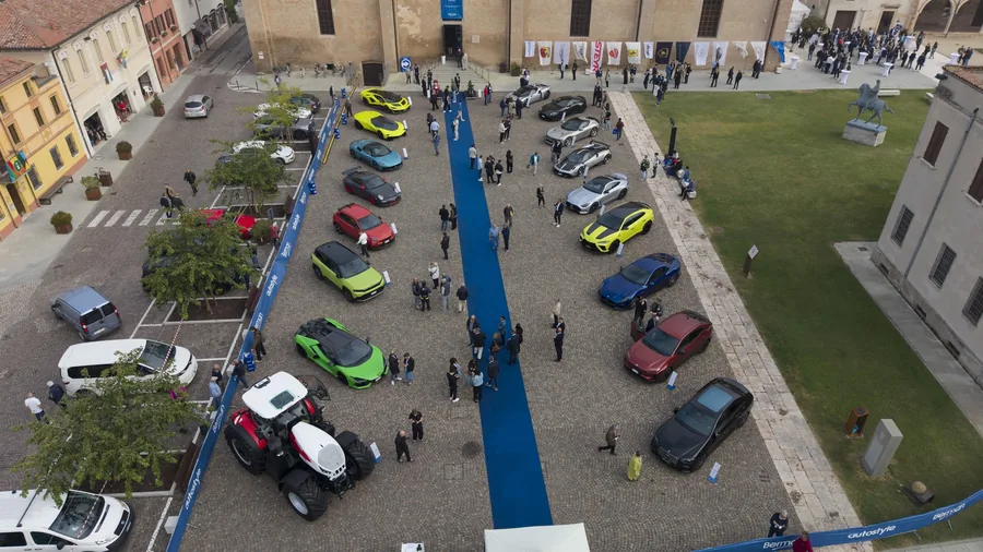 Aerial view of the square in San Benedetto Po with the vehicles on show at Autostyle 2026, Ducati among them