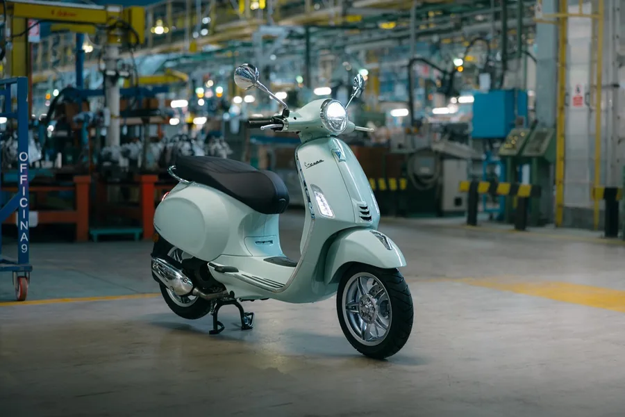 Vespa Primavera 125 in pale green in a factory hall